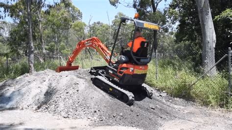 how steep can a mini excavator climb|mini ex drive up slope.